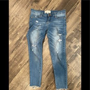 Distressed raw hem skinny jeans